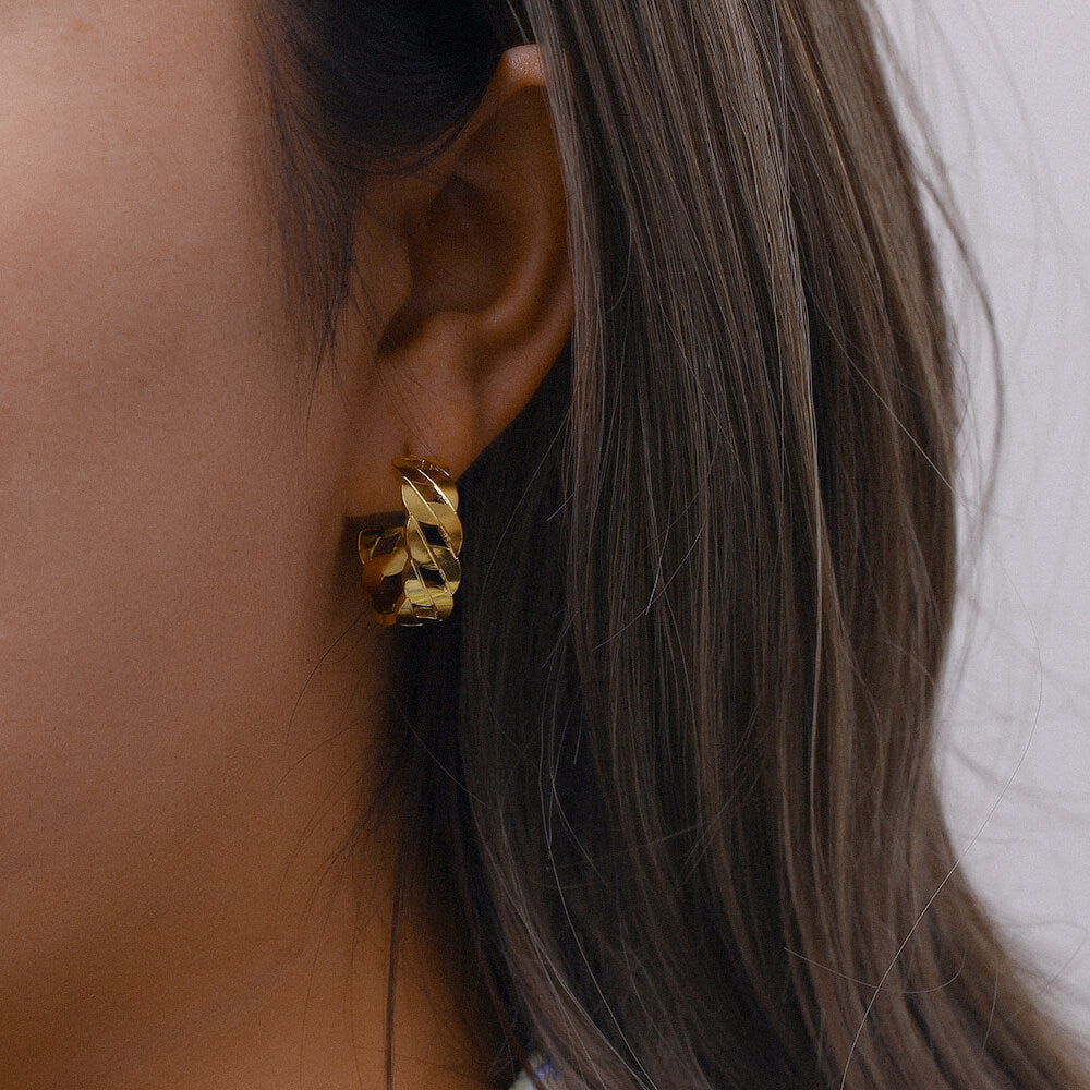 Front on view of model wearing hollow chain gold filled earrings
